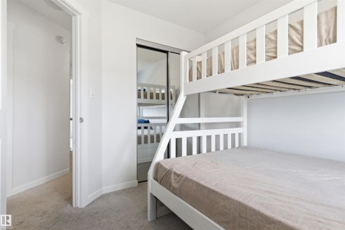 Bedroom featuring light gray carpet flooring and white walls - 9 850 Secord Boulevard, Edmonton, AB - Indoor Photo Showing Bedroom