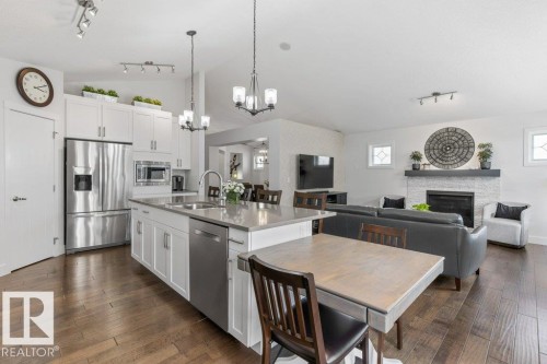 2107 Redtail Common, Edmonton, AB - Indoor Photo Showing Kitchen With Fireplace With Upgraded Kitchen
