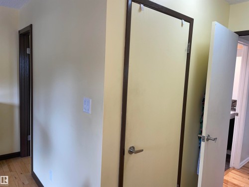 Interior entryway featuring light-colored walls and dark wood door frames - 14212 30 Street, Edmonton, AB - Indoor