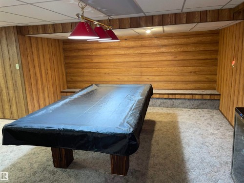 Entertainment area featuring wood paneling, recessed lighting, and a pool table - 14212 30 Street, Edmonton, AB - Indoor Photo Showing Other Room