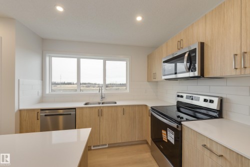 17237 4 Street, Edmonton, AB - Indoor Photo Showing Kitchen With Stainless Steel Kitchen With Double Sink