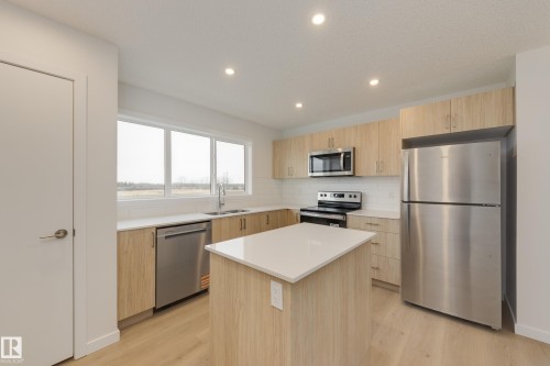 17235 4 Street, Edmonton, AB - Indoor Photo Showing Kitchen With Stainless Steel Kitchen With Double Sink