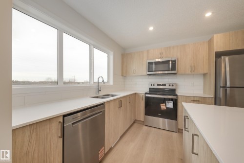 17235 4 Street, Edmonton, AB - Indoor Photo Showing Kitchen With Stainless Steel Kitchen With Double Sink With Upgraded Kitchen