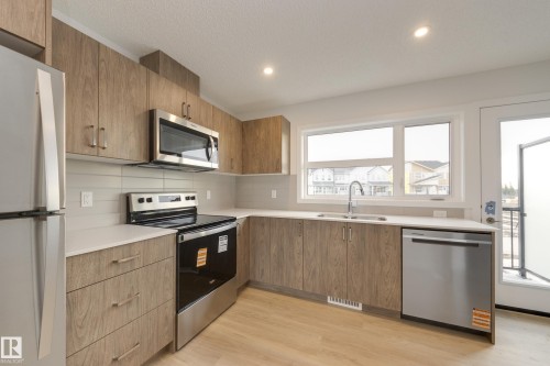 17233 4 Street, Edmonton, AB - Indoor Photo Showing Kitchen With Stainless Steel Kitchen With Double Sink