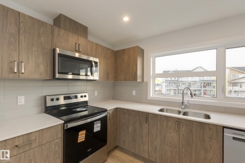 17233 4 Street, Edmonton, AB - Indoor Photo Showing Kitchen With Stainless Steel Kitchen With Double Sink