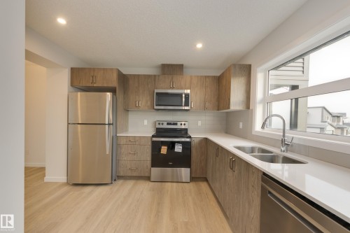 17233 4 Street, Edmonton, AB - Indoor Photo Showing Kitchen With Stainless Steel Kitchen With Double Sink