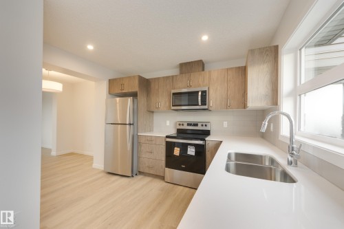 17233 4 Street, Edmonton, AB - Indoor Photo Showing Kitchen With Stainless Steel Kitchen With Double Sink