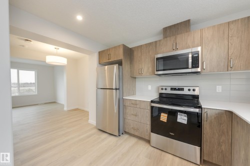 17233 4 Street, Edmonton, AB - Indoor Photo Showing Kitchen With Stainless Steel Kitchen