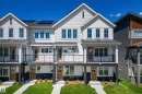 View of front facade featuring board and batten siding, brick siding, a shingled roof, and a balcony - 17234 4 Street, Edmonton, AB  - Outdoor With Balcony With Facade 