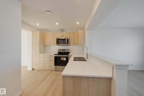 17232 4 Street, Edmonton, AB - Indoor Photo Showing Kitchen With Stainless Steel Kitchen With Double Sink