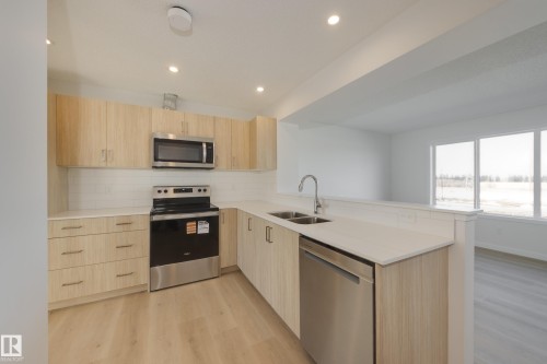 17232 4 Street, Edmonton, AB - Indoor Photo Showing Kitchen With Stainless Steel Kitchen With Double Sink