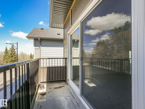 Private balcony featuring black metal railings and a sliding glass door - 6125 Crawford Drive, Edmonton, AB - Outdoor With Exterior