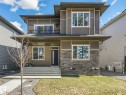 Contemporary two-story exterior featuring a prominent covered entry - 6125 Crawford Drive, Edmonton, AB  - Outdoor With Exterior 