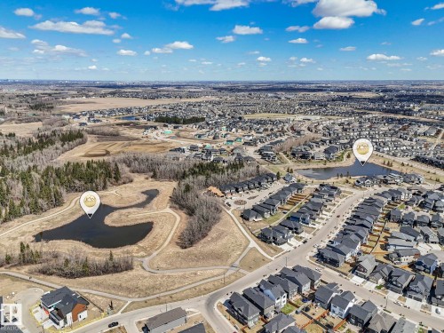 Aerial perspective showcasing a residential community with numerous homes - 6125 Crawford Drive, Edmonton, AB - Outdoor With View