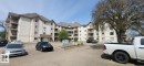 Multi-story residential building with light-colored siding and dark shingled roofing - 204 11218 80 Street, Edmonton, AB  - Outdoor With Balcony With Facade 