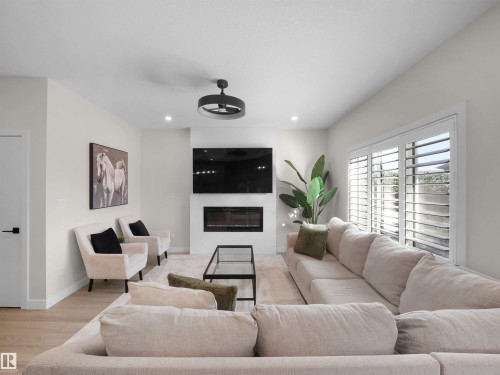 821 Morris Avenue, Leduc, AB - Indoor Photo Showing Living Room With Fireplace