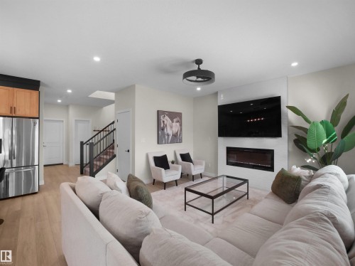 821 Morris Avenue, Leduc, AB - Indoor Photo Showing Living Room With Fireplace