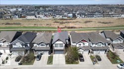 Two-story residential architecture with a gabled roofline and attached front-facing garage - 