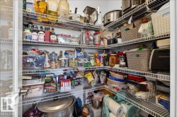 Walk-in pantry featuring abundant wire shelving - 