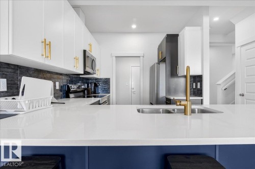 15 1910 Collip View View Sw, Edmonton, AB - Indoor Photo Showing Kitchen With Double Sink