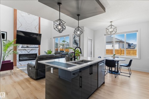 439 Roberts Cres, Leduc, AB - Indoor Photo Showing Kitchen With Fireplace With Double Sink