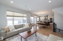 Spacious living area featuring large windows providing natural light, hardwood flooring, and recessed lighting throughout - 14 Edgewater Terr North, St. Albert, AB  - Indoor Photo Showing Living Room 