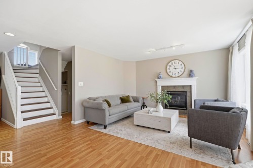 3327 32 Avenue, Edmonton, AB - Indoor Photo Showing Living Room With Fireplace
