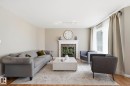 3327 32 Avenue, Edmonton, AB  - Indoor Photo Showing Living Room With Fireplace 