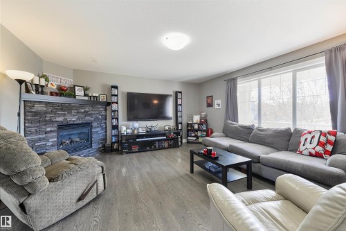 102 Kirpatrick Bend, Leduc, AB - Indoor Photo Showing Living Room With Fireplace