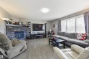 102 Kirpatrick Bend, Leduc, AB  - Indoor Photo Showing Living Room With Fireplace 