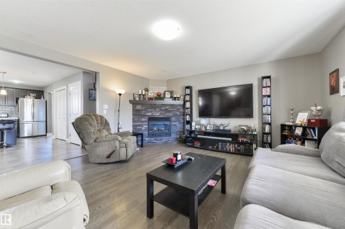 102 Kirpatrick Bend, Leduc, AB - Indoor Photo Showing Living Room With Fireplace