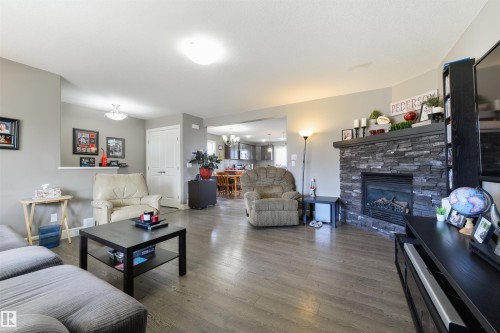 102 Kirpatrick Bend, Leduc, AB - Indoor Photo Showing Living Room With Fireplace