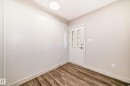 Entryway featuring a decorative glass panel door, wood-finish flooring, and a flush-mount ceiling light - 13124 83 Street, Edmonton, AB  - Indoor Photo Showing Other Room 