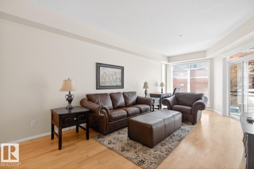 Spacious living area featuring light wood-finish flooring, neutral wall tones, and recessed lighting - 614 10503 98 Avenue, Edmonton, AB - Indoor Photo Showing Living Room