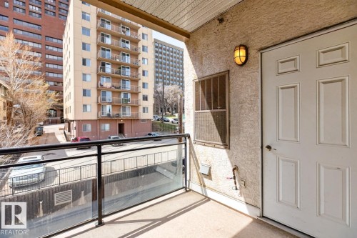 Private balcony with glass panel railing and textured stucco exterior - 614 10503 98 Avenue, Edmonton, AB - Outdoor