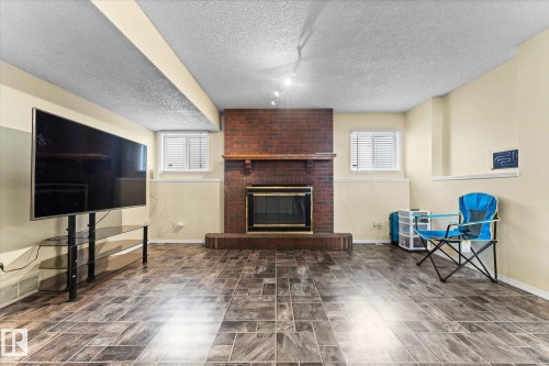 124 Klarvatten Road, Edmonton, AB - Indoor Photo Showing Living Room With Fireplace