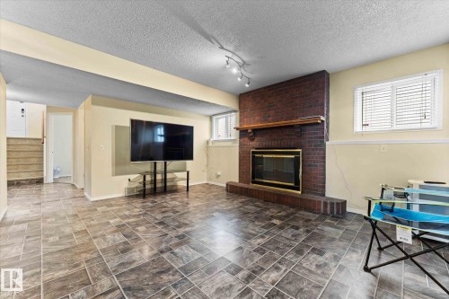 124 Klarvatten Road, Edmonton, AB - Indoor Photo Showing Living Room With Fireplace
