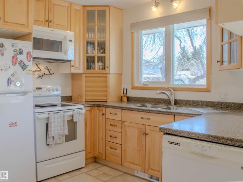 8651 27 Avenue, Edmonton, AB - Indoor Photo Showing Kitchen With Double Sink