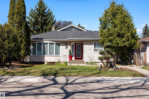 Single-story residence featuring light-colored siding and a dark shingle roof - 9602 85 Street, Edmonton, AB - Outdoor