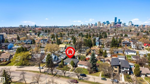 Residential neighborhood setting with a prominent city skyline backdrop - 9602 85 Street, Edmonton, AB - Outdoor With View