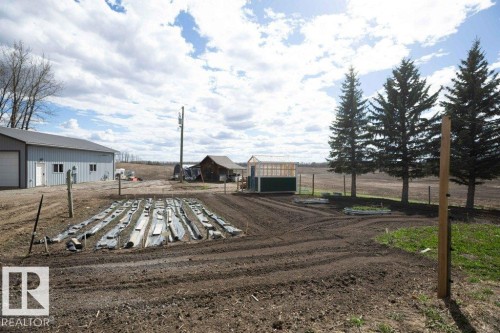 Expansive tilled ground with a structured planting area - 27132A Twp Rd 632, Rural Westlock County, AB - Outdoor With View