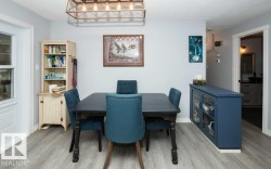 Light gray wood-finish flooring complements the neutral wall color - 