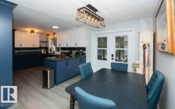 Bright dining space with wood-finish flooring and direct access to the kitchen - 