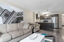 Open-concept living space with dark wood-finish flooring - 221 344 Windermere Road, Edmonton, AB  - Indoor 
