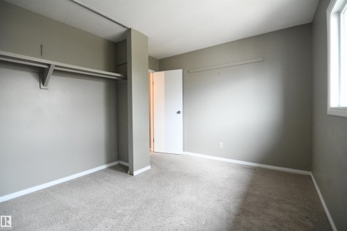 Both the second and third bedrooms are nicely sized, with generous closets.  This one looks out the front of the unit - 6706 36A Avenue, Edmonton, AB - Indoor