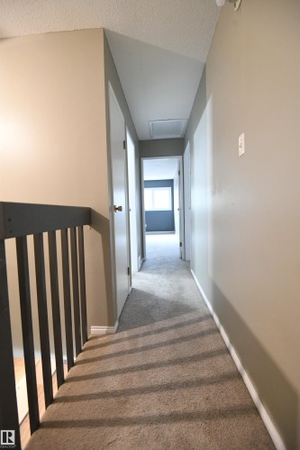 The master bedroom is at the rearmost end of the home, with the 2nd and 3rd bedrooms close enough to keep an eye on the kids, if you want, and far enough away from them to enjoy some well deserved quiet time - 6706 36A Avenue, Edmonton, AB - Indoor Photo Showing Other Room