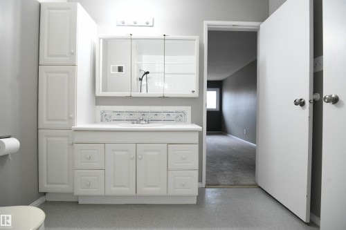 The main bathroom on the top floor serves both the 2nd and 3rd bedrooms via the hallway door, but also doubles as a private ensuite for the master bedroom, via it's own private door.  Another nice touch - 6706 36A Avenue, Edmonton, AB - Indoor Photo Showing Bathroom