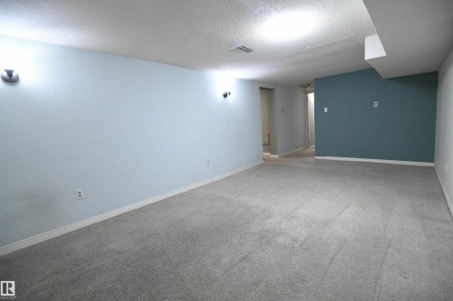 Large rec rooms are great, and give a family a second entertaining space.  Whether for gaming, enjoying movies, or having guests over, this is a great space.  An additional den/office is also located adjacent to this room - 6706 36A Avenue, Edmonton, AB - Indoor