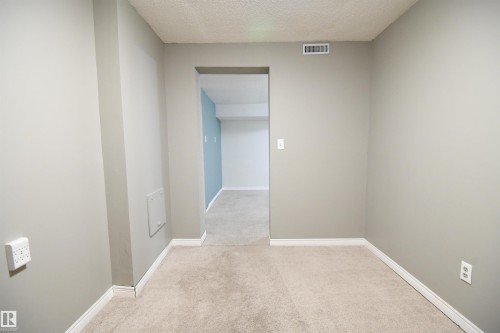 This additional room downstairs makes a great den or office, and has some additional storage space in it's closet.  This home uses all of it's space very efficiently, and provides great utility - 6706 36A Avenue, Edmonton, AB - Indoor Photo Showing Other Room