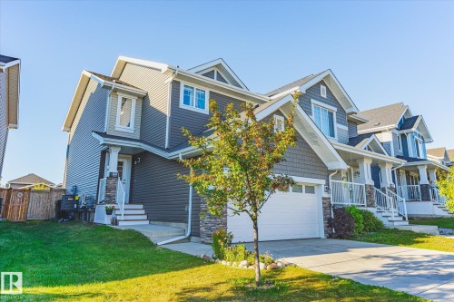 Contemporary two-story residence featuring grey horizontal siding and shake accents - 6864 Evans Wynd, Edmonton, AB - Outdoor With Facade